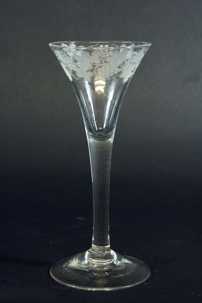 A WINE the funnel bowl and stem engraved with a band of fruiting vines, 7ins. (17.5cms.)