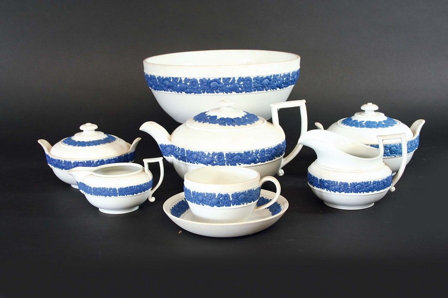 AN EXTENSIVE WEDGWOOD SALT GLAZED TEA SERVICE each grey/white body sprigged with a band of blue