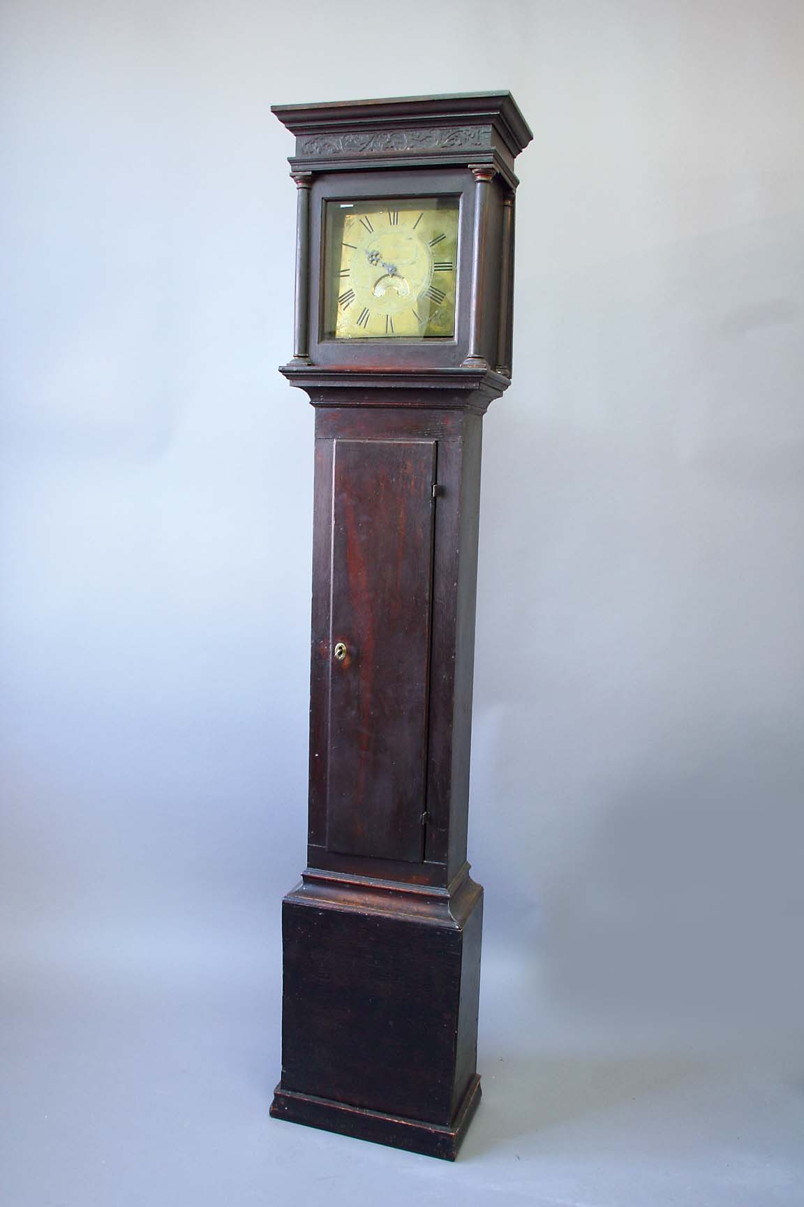 AN OAK THIRTY HOUR LONGCASE CLOCK dial brass, signed Thos. Powell, Ravensthorp, calendar crescent,