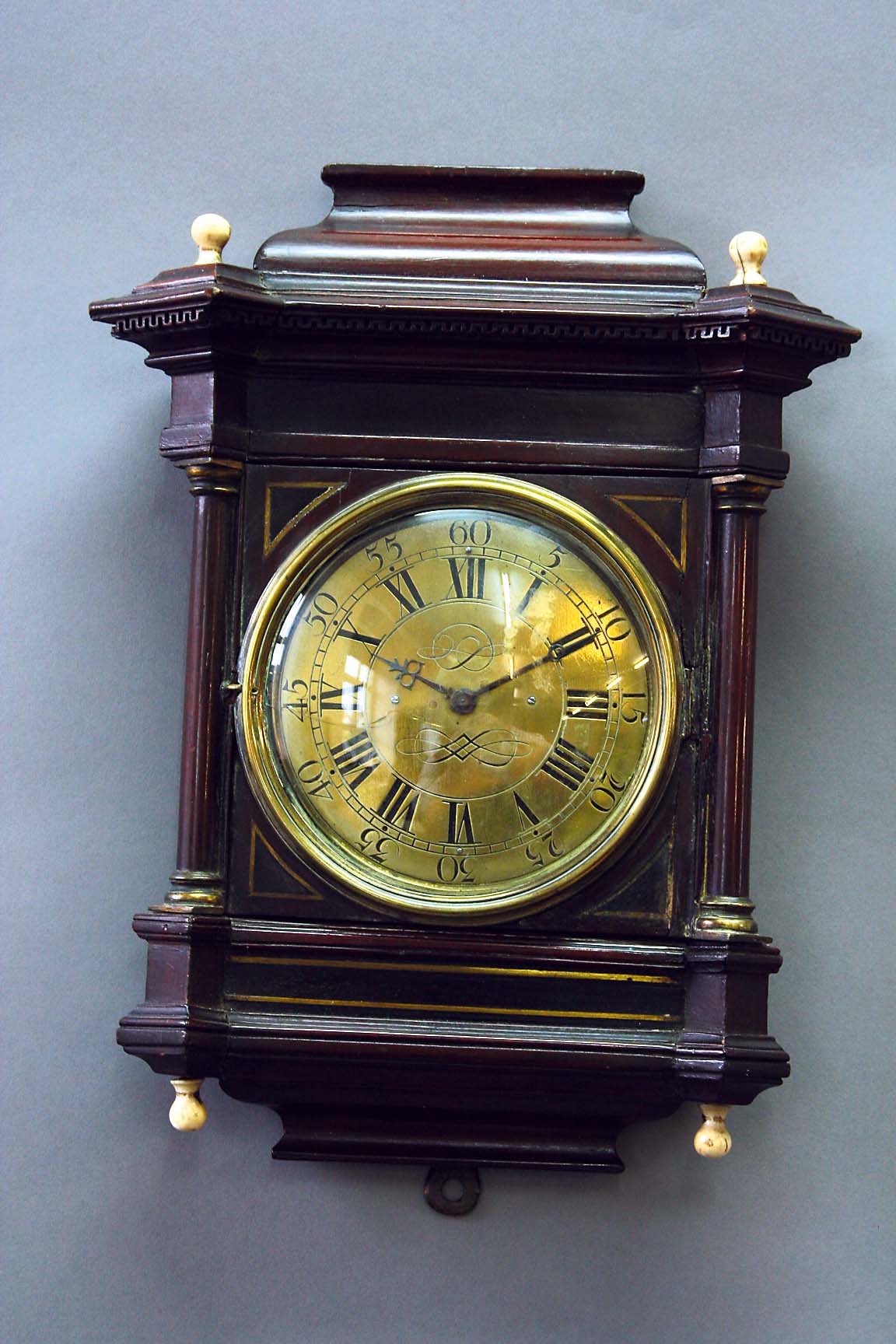 A MAHOGANY WALL TIMEPIECE dial 4 3/4 inches, movement watch type, case of architectural form, the