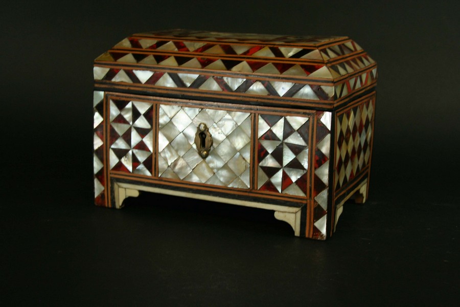 AN OTTOMAN CASKET veneered in red tortoiseshell and mother of pearl lozenge pattern, the feet with