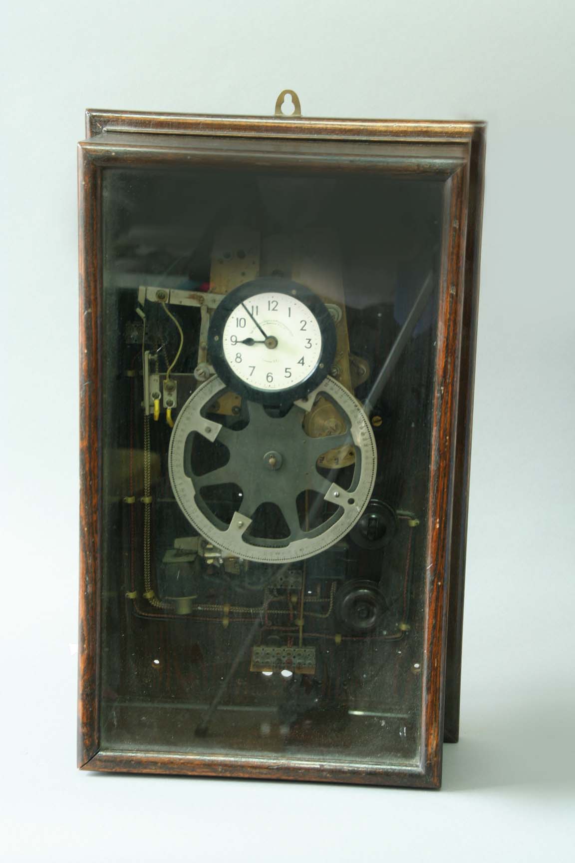 AN OAK CASED TIMING MACHINE dial signed Time Recorder Supply and Maintenance Co. Ltd, 157/159