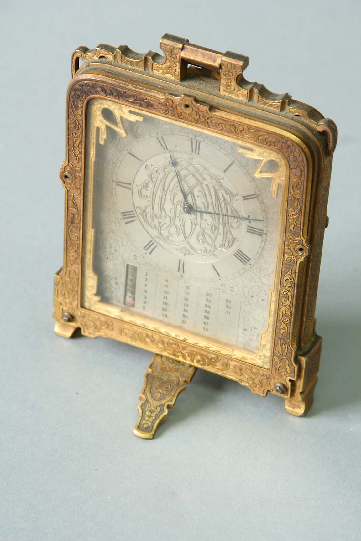 A COLE TYPE STRUT CLOCK dial silvered, engraved with a monogram and foliage, signed C F Hancock,