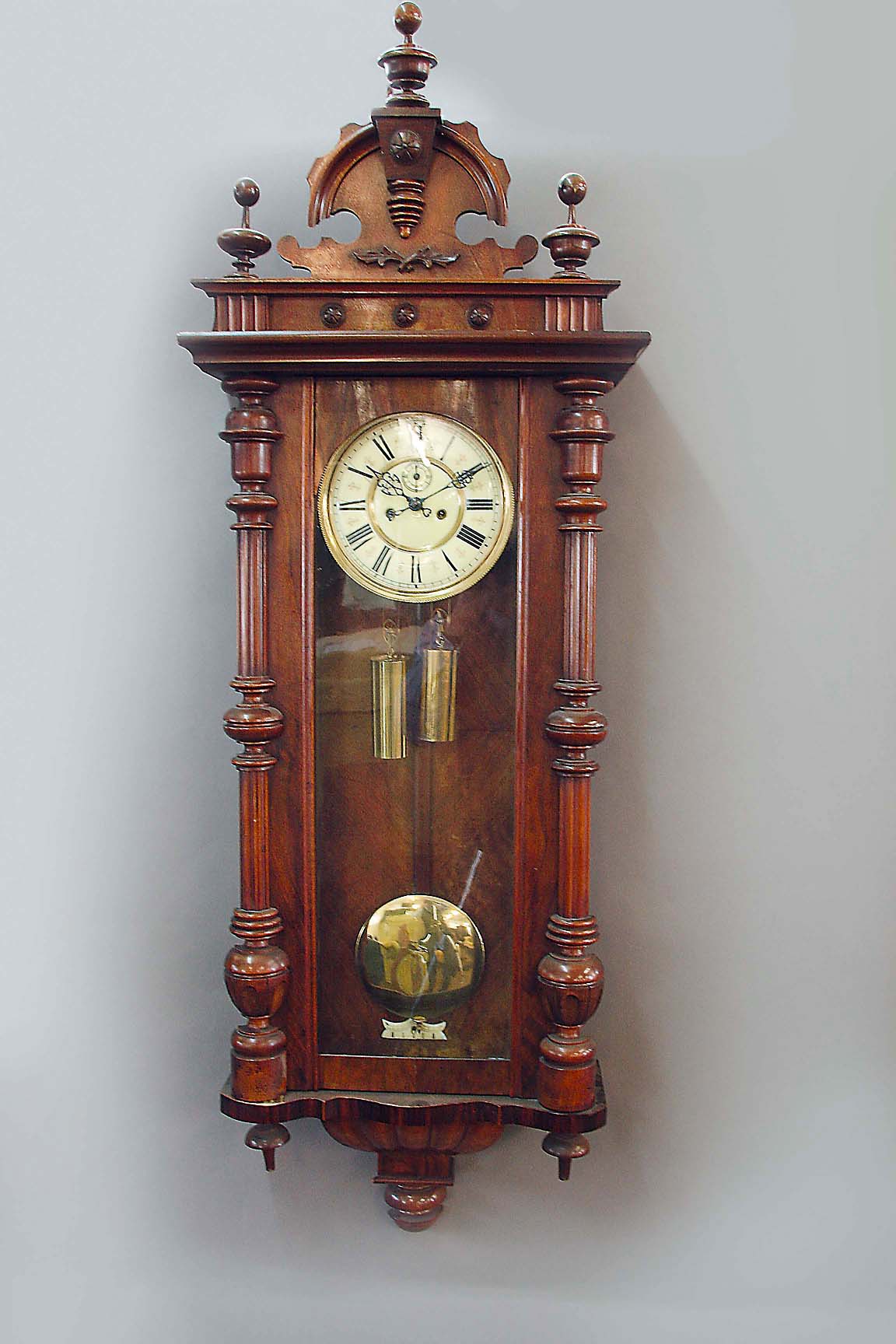 A WALNUT VIENNA STYLE REGULATOR CLOCK dial cream annular, movement striking on a gong, 52ins. (