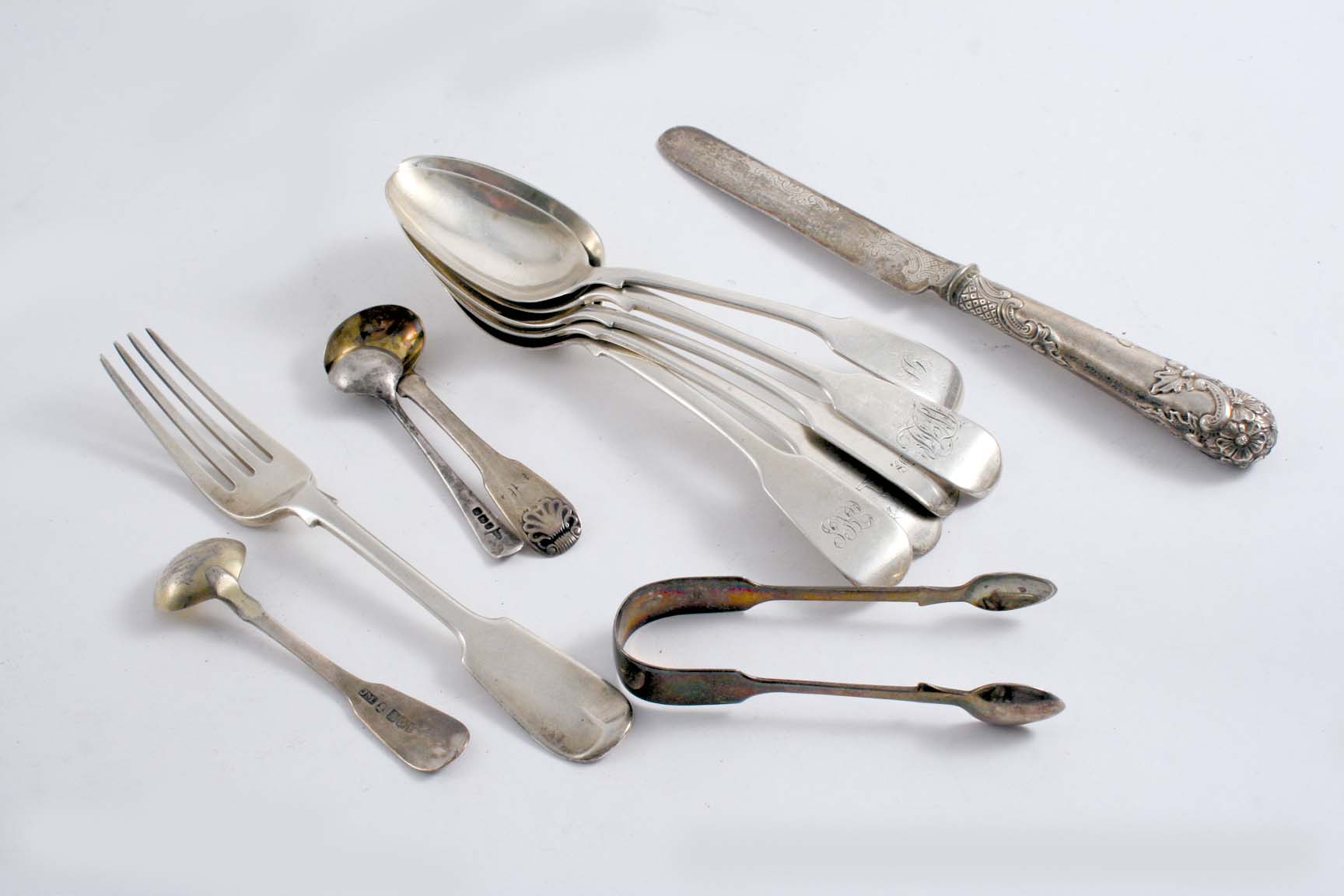 A MIXED LOT: Five various antique Fiddle dessert spoons, either crested or initialled, a dessert