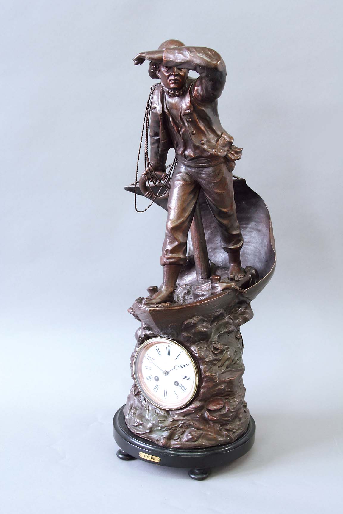 A BRONZED SPELTER CLOCK "RESCUE" dial white enamel, signed George White, York, movement drum,