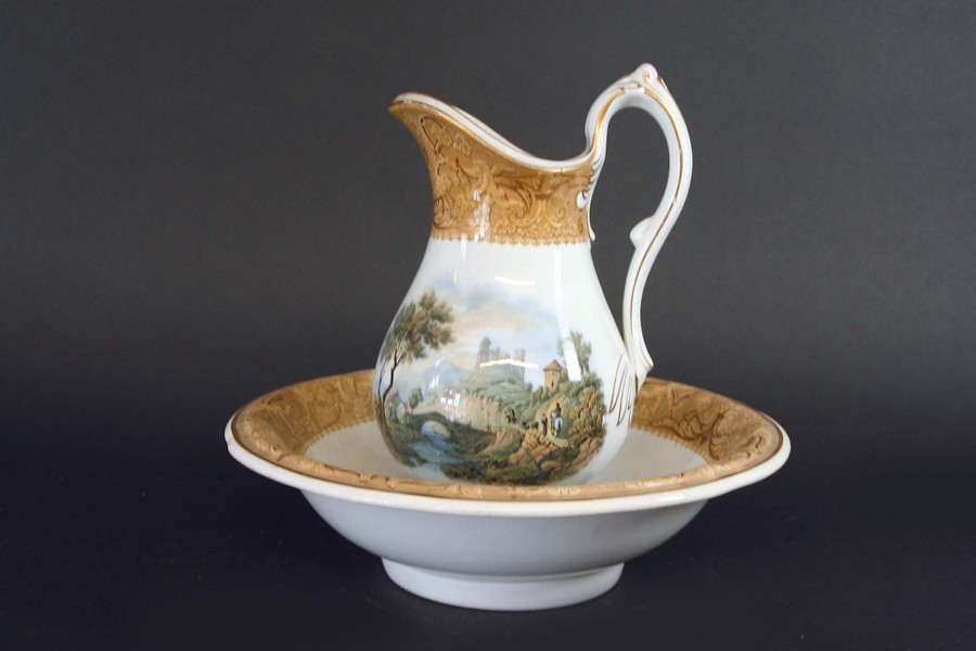 A PRATT TYPE JUG AND BASIN each piece printed with a mountainous riverscape within a biscuit