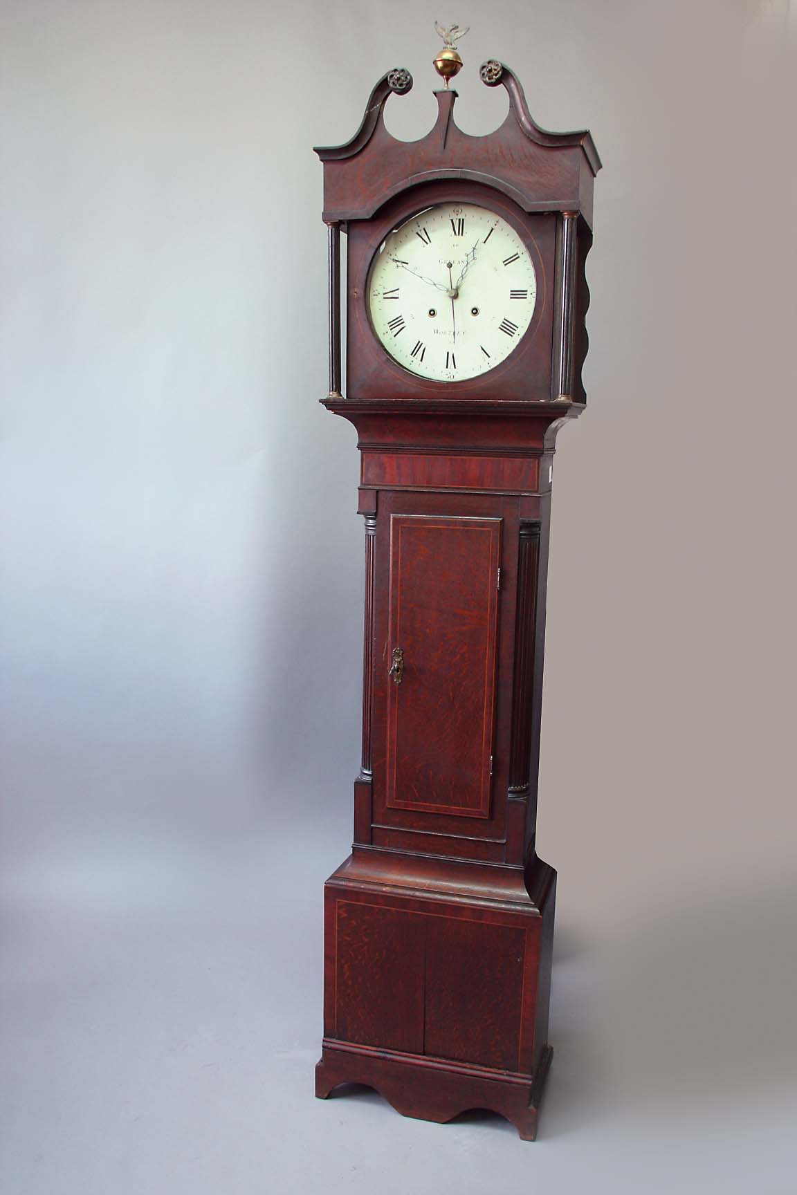 AN OAK LONGCASE CLOCK dial cream painted, sweep seconds hand, signed Gerrans, Wortley, case  the