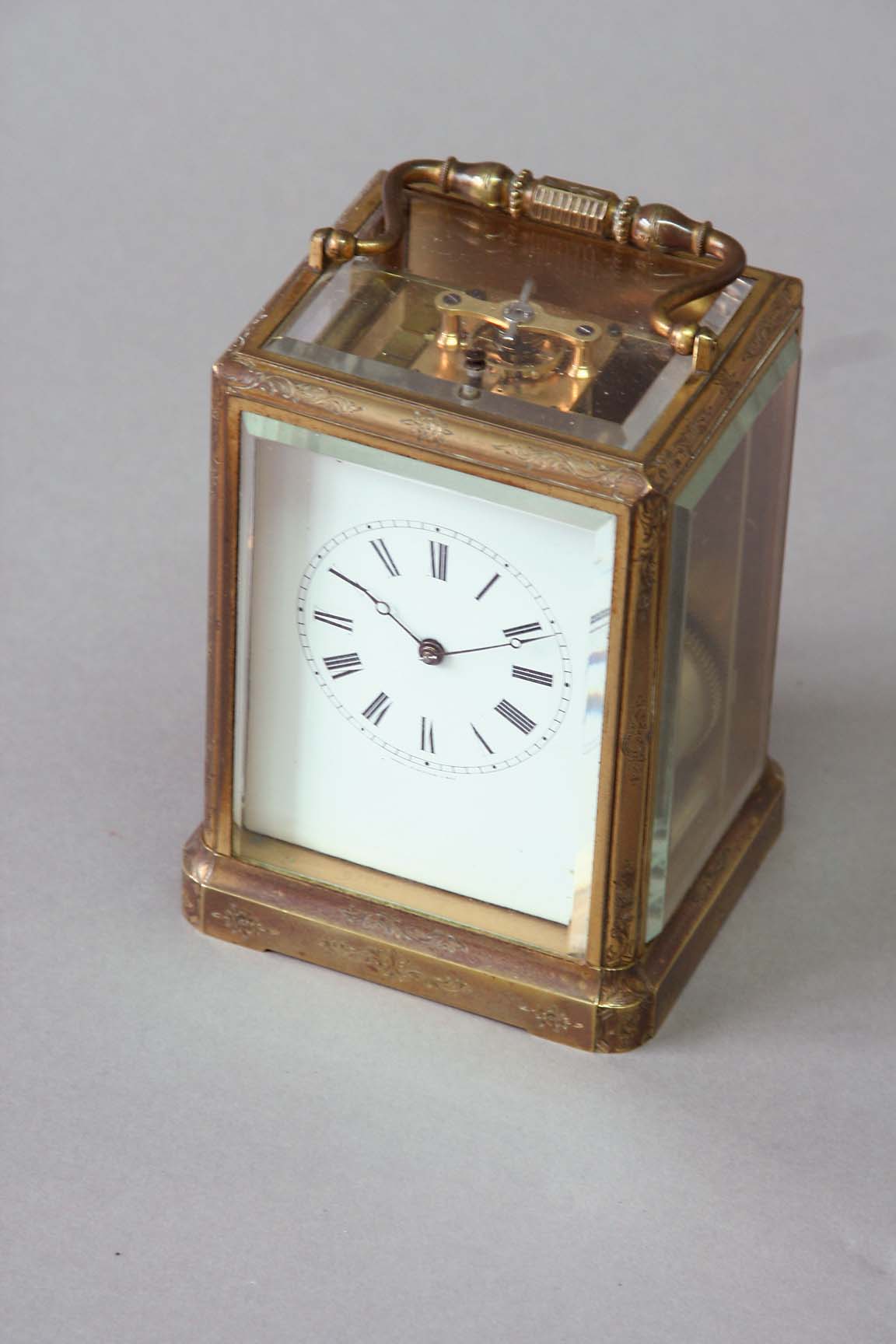 A CARRIAGE CLOCK dial white enamel, movement repeating, with cylinder escapement striking on a bell,