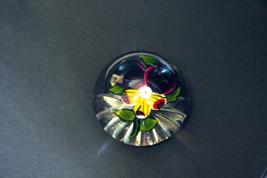 A BACCARAT SMALL PANSY WEIGHT with a star cut base, 2ins. (5cms.) dia.Condition reports are