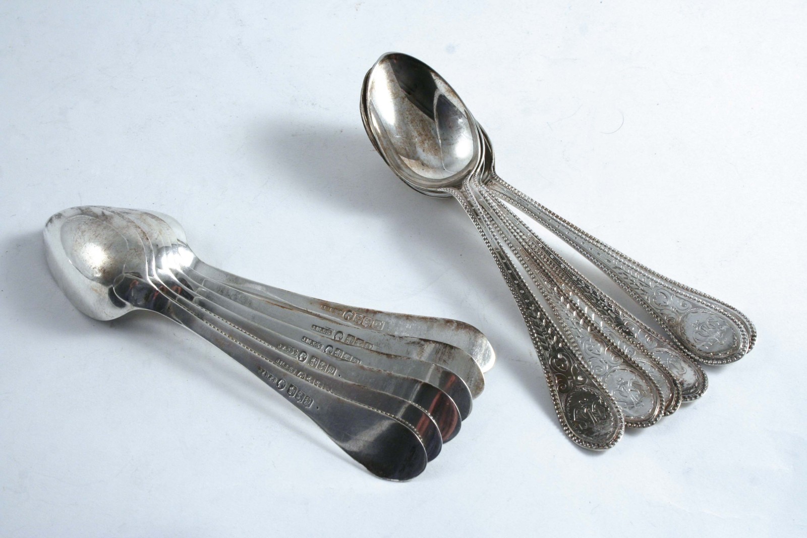 A SET OF TWELVE VICTORIAN SCOTTISH TEA SPOONS with engraved decoration & bead borders,