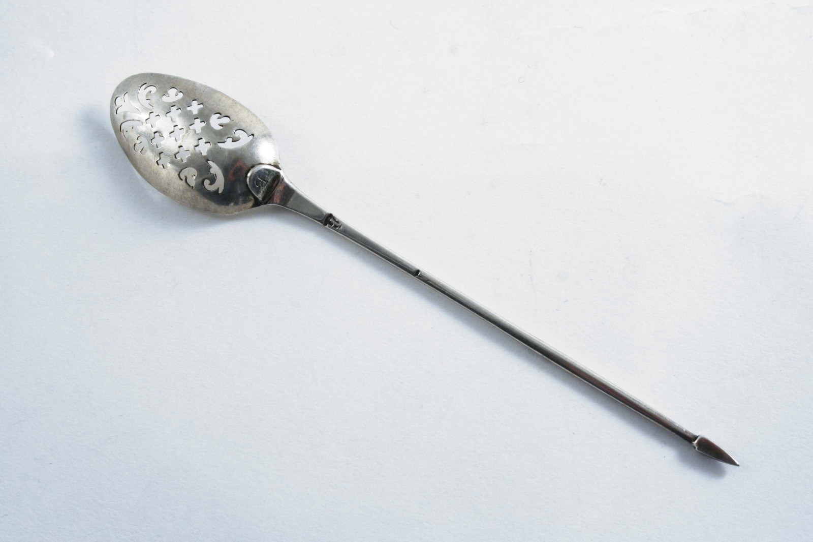 A GEORGE III MOTE SPOON with a diamond-point finial, a single drop, initialled "B", the bowl pierced