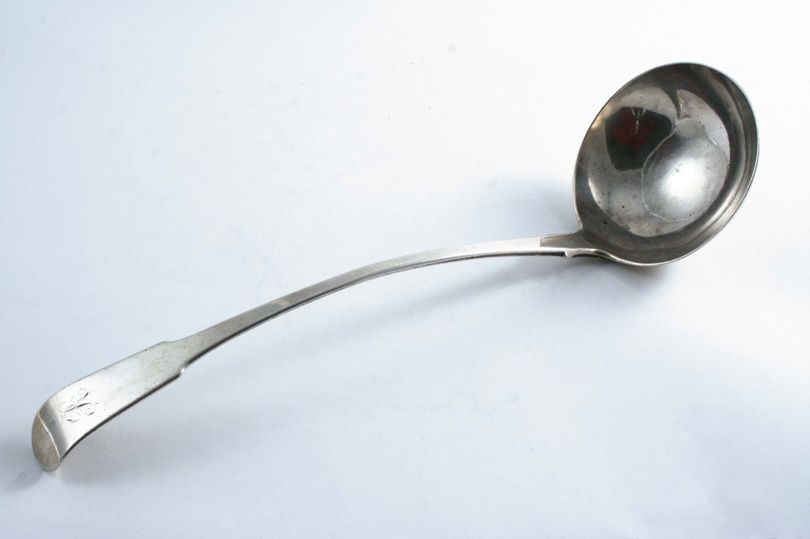 A GEORGE IV SCOTTISH PROVINCIAL FIDDLE PATTERN SOUP LADLE initialled "R", by David Gray of