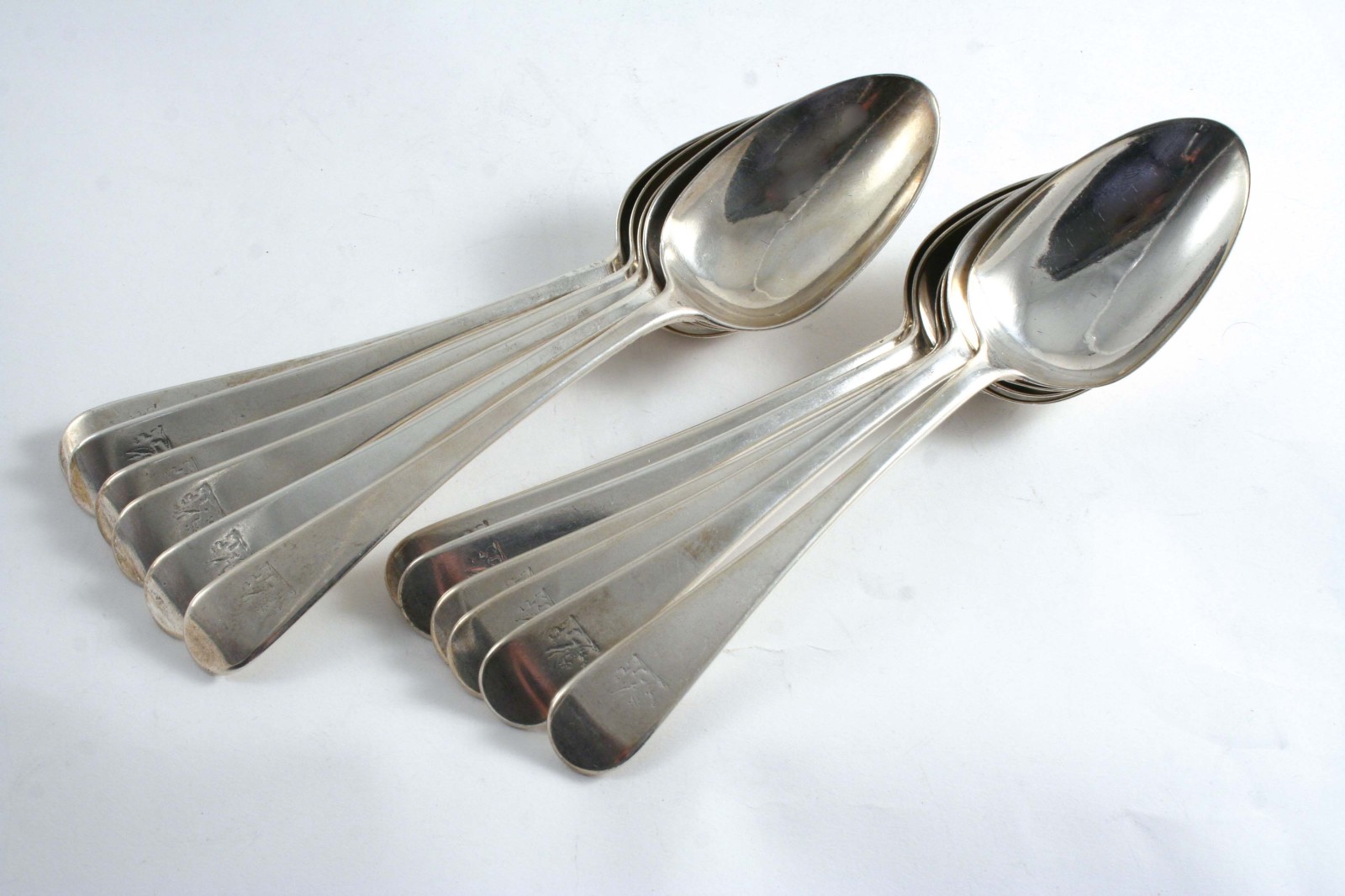 A SET OF TWELVE EARLY VICTORIAN OLD ENGLISH PATTERN TABLE SPOONS crested, by Richard Sibley (II),