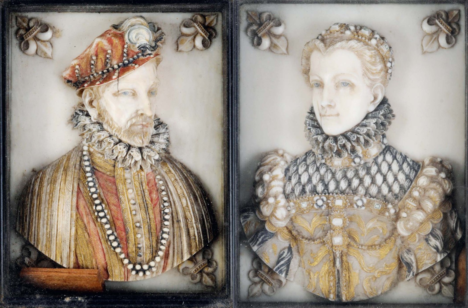 A PAIR OF IVORY PORTRAIT PLAQUES coloured & carved in relief with a portrait of Charles IX of France