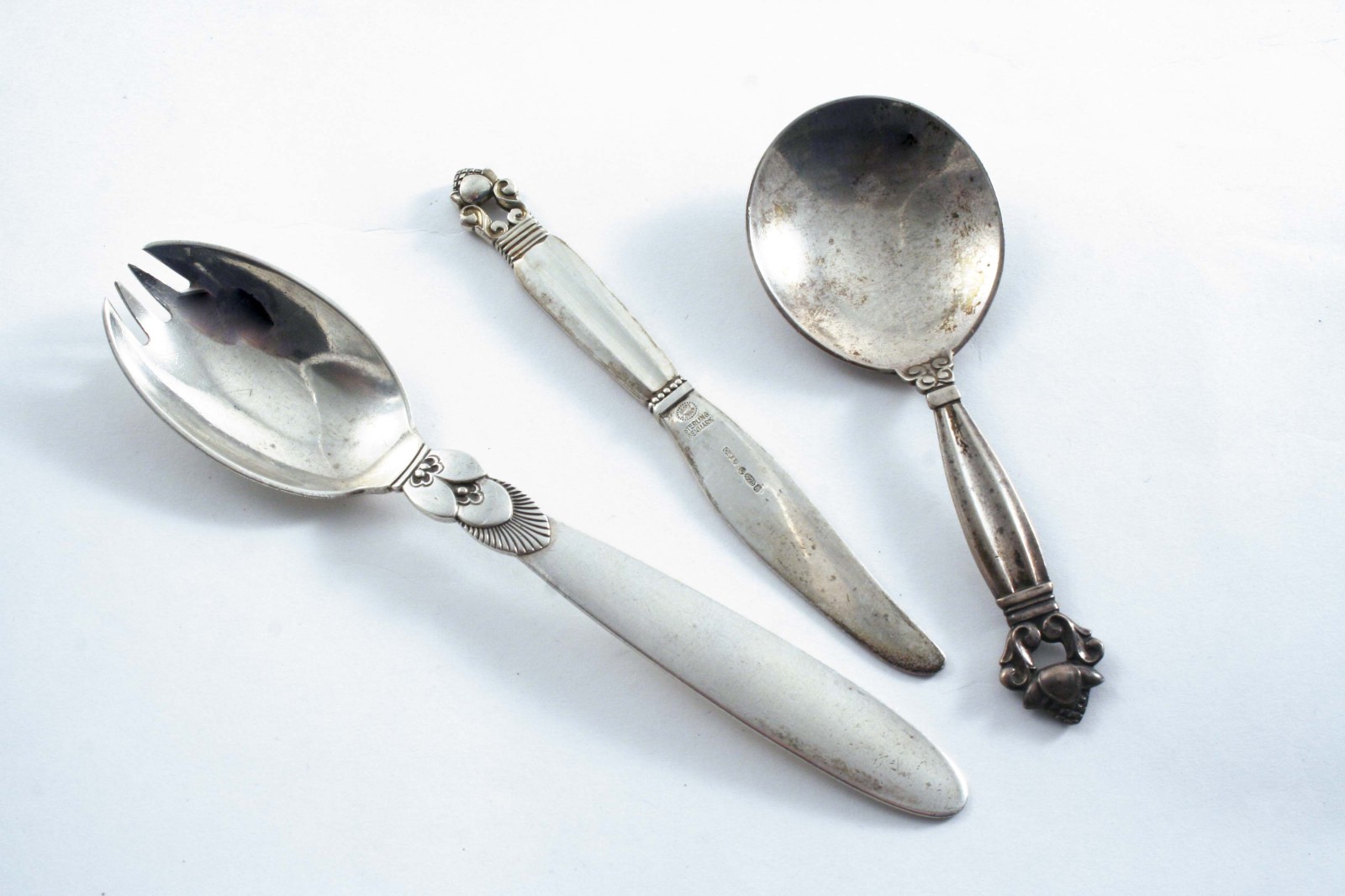 BY GEORG JENSEN: A modern Danish Acorn pattern caddy spoon, import marked London 1926, a small Acorn