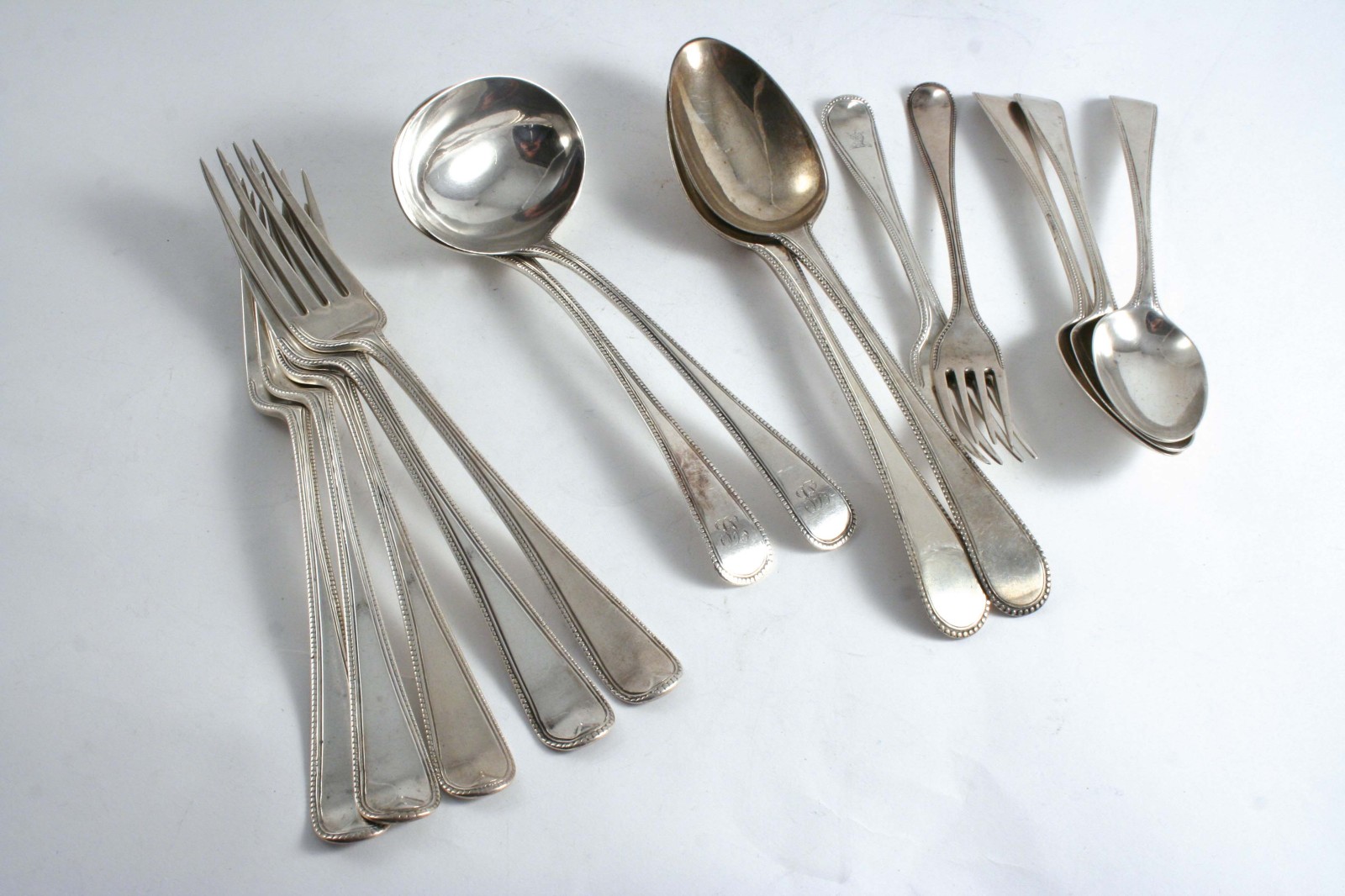 ASSORTED BEAD PATTERN FLATWARE (SINGLE STRUCK & SOME LATER BEADED): a pair of George III sauce