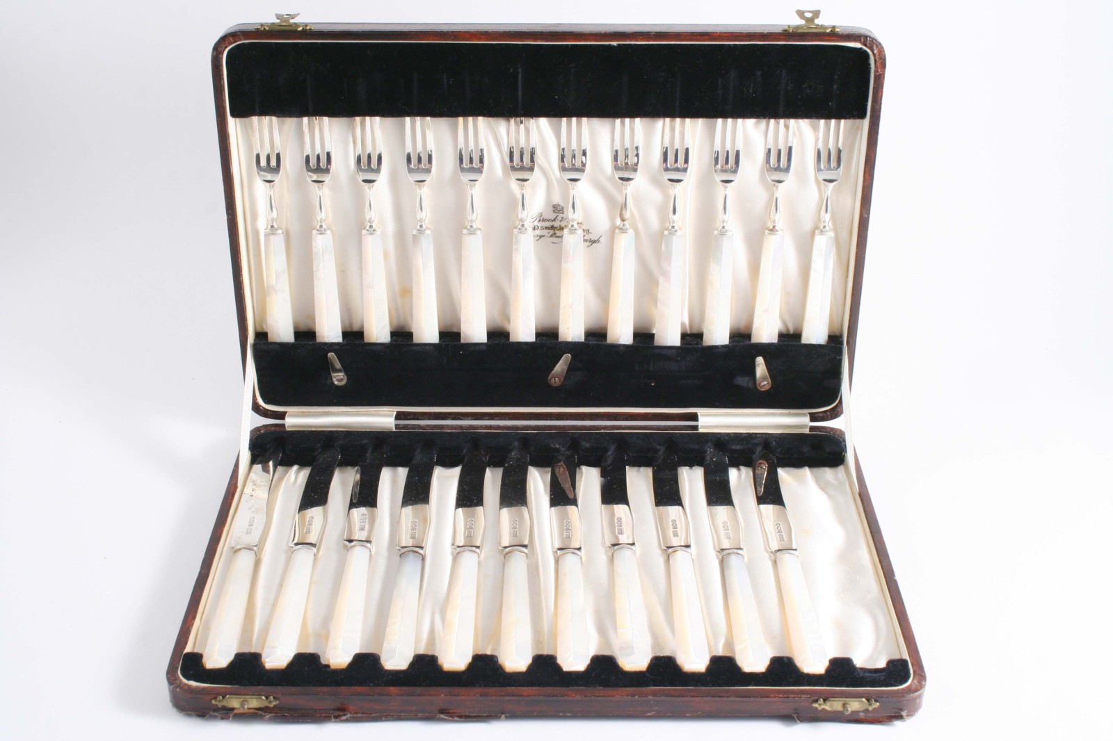 A MODERN CASED SET OF ELEVEN DESSERT/FRUIT KNIVES & TWELVE FORKS with faceted, mother of pearl