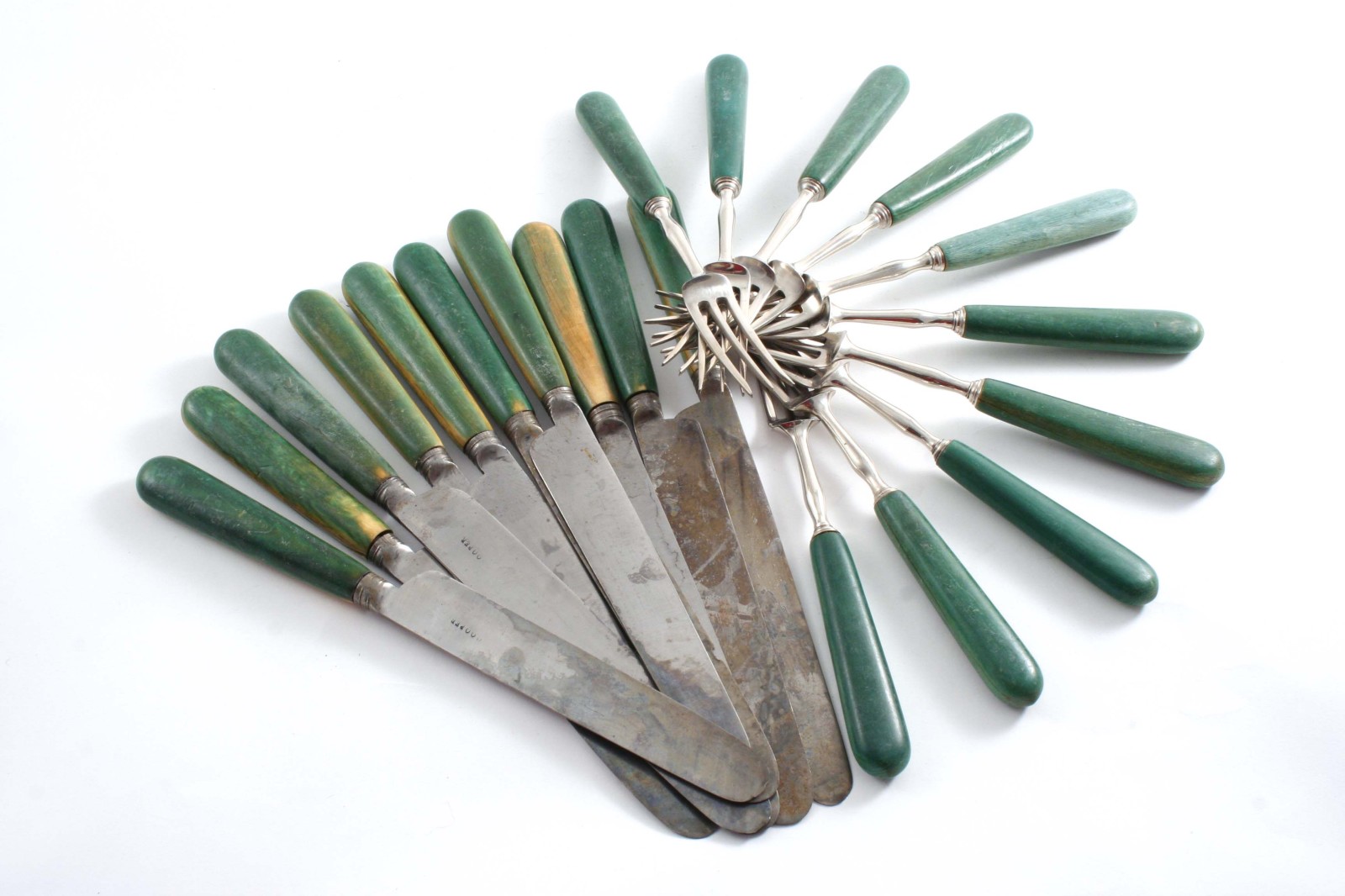A SET OF TEN GEORGE III TABLE KNIVES  with steel blades & green-stained ivory handles, and a set
