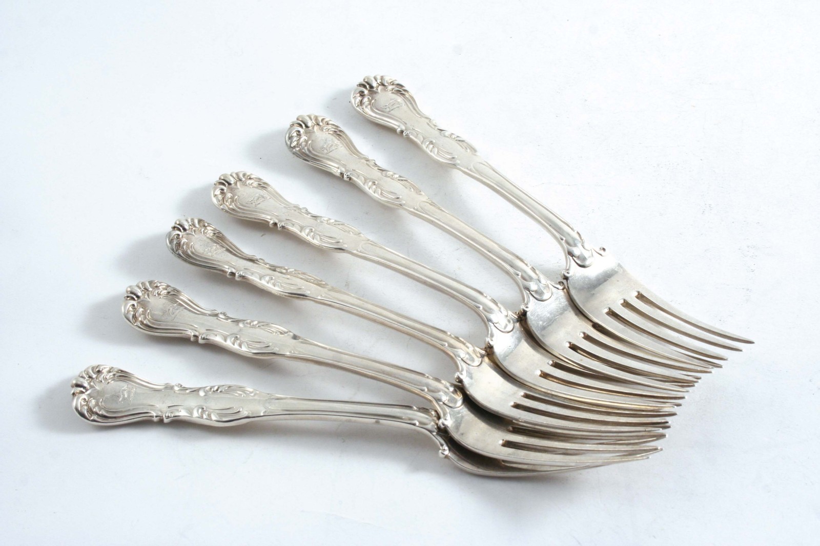 A VICTORIAN MATCHED SET OF SIX DEVONSHIRE PATTERN DESSERT FORKS crested, by two makers (George Adams