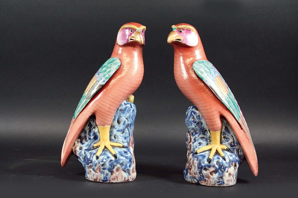 A PAIR OF 18TH CENTURY STYLE HAWKS each rosy cheeked bird perched on a rocky outcrop, 10 3/4ins. (