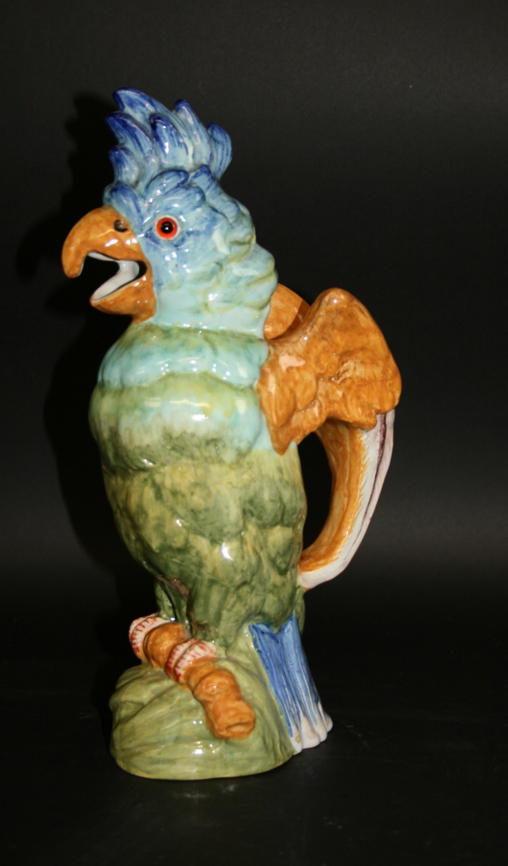 MOSANIC JUG - PARROT an interesting pottery jug in the form of a Parrot, the wings forming the