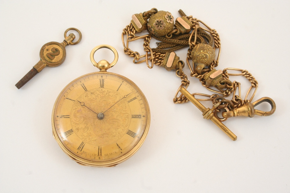 AN 18CT. GOLD OPEN FACED POCKET WATCH the gold foliate dial is set with Roman numerals, with