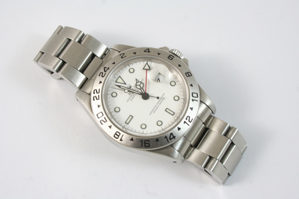 A GENTLEMAN`S STAINLESS STEEL OYSTER PERPETUAL DATE EXPLORER II WRISTWATCH BY ROLEX the signed white
