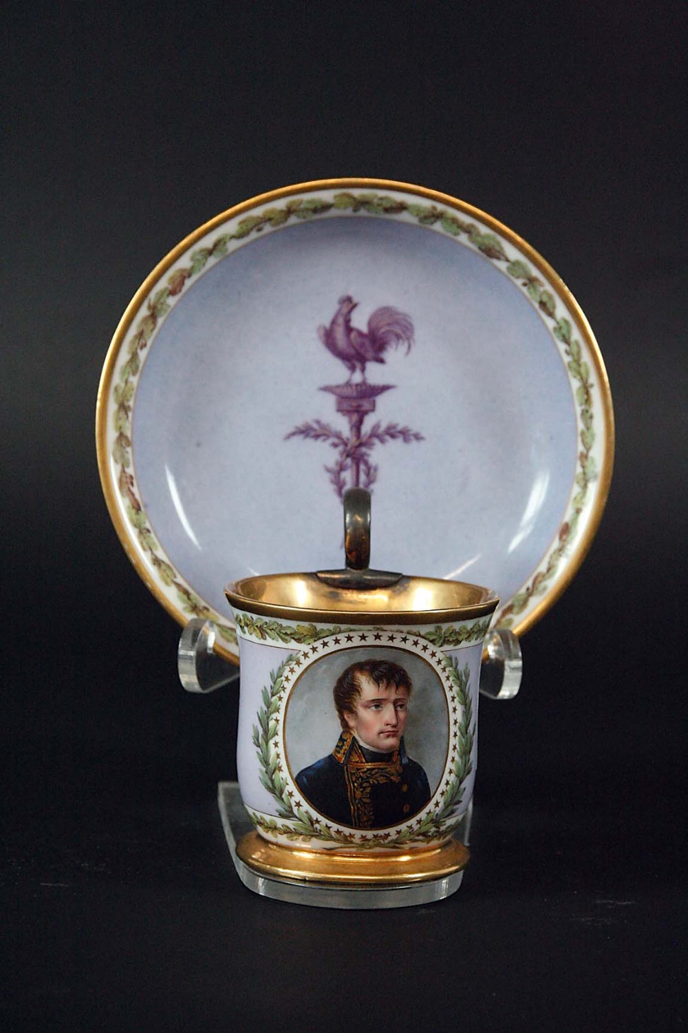 A SEVRES CABINET CUP AND SAUCER the cup painted with a portrait bust of Napoleon, on a lilac ground,