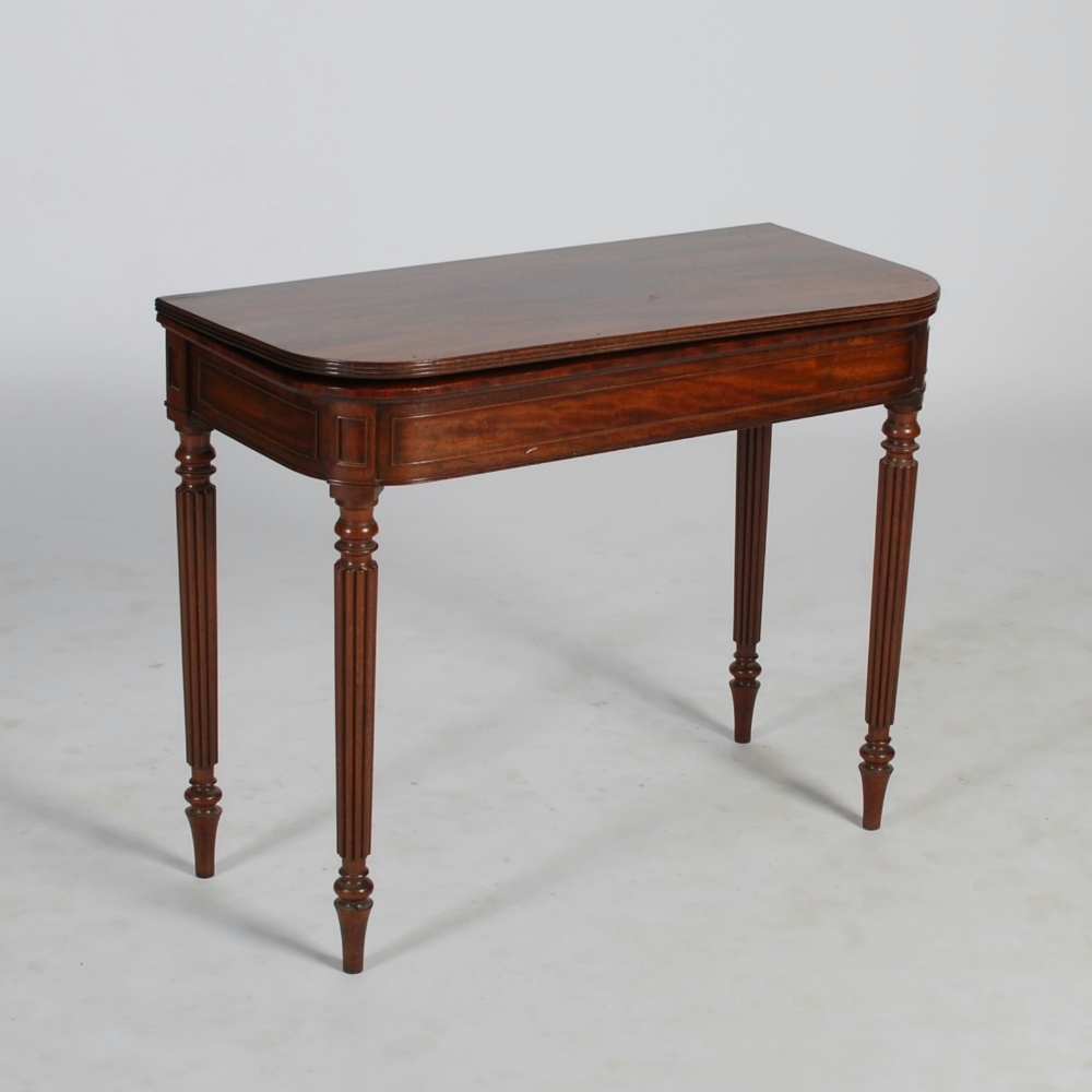 A 19th century mahogany tea table, the hinged D-shaped top with reeded edge above a plain frieze