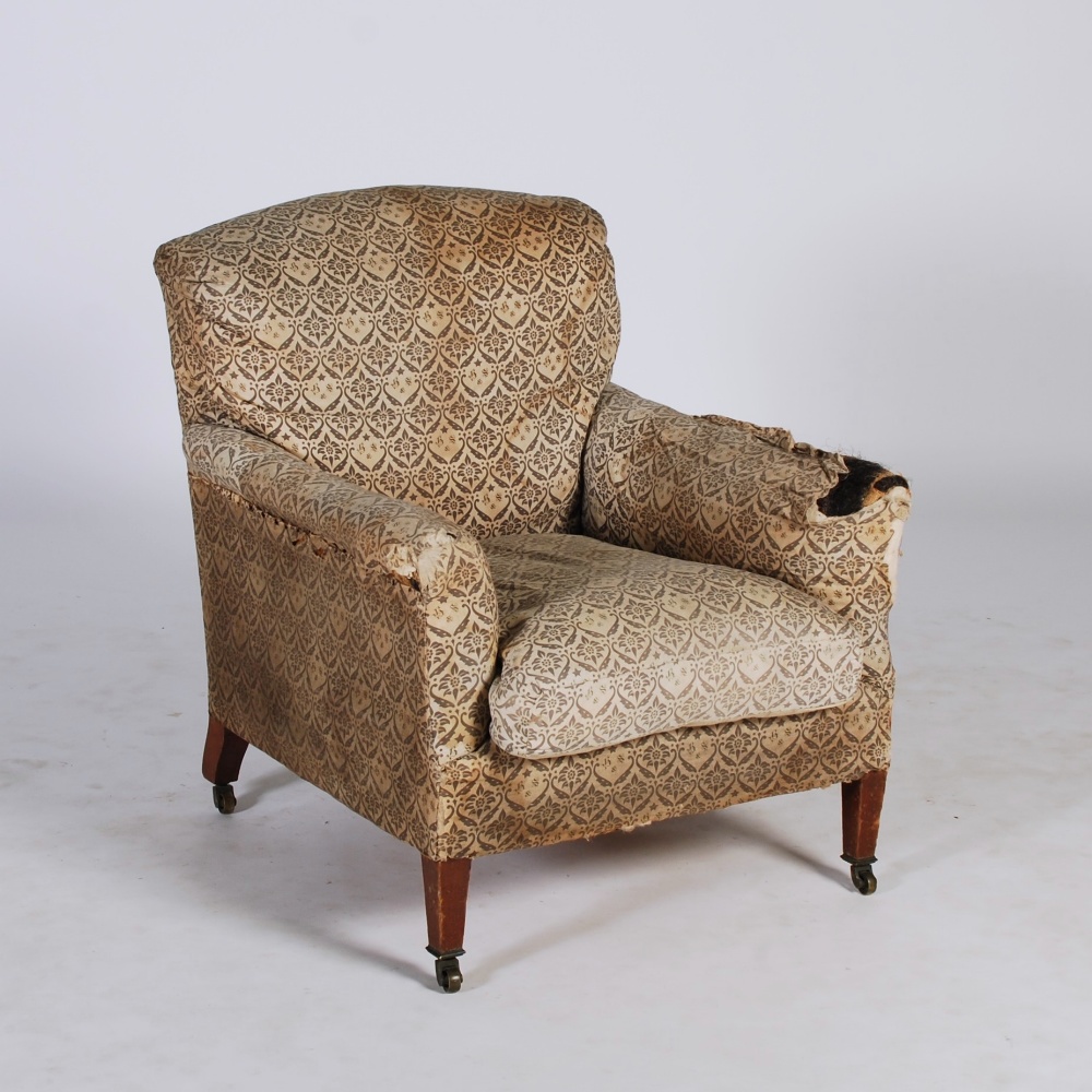 A late 19th/ early 20th century mahogany armchair by HOWARD & SONS LTD, the back, arms and seat