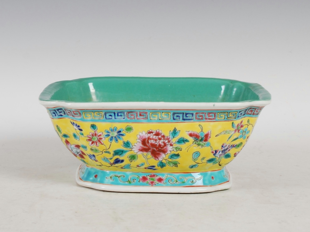 A Chinese porcelain yellow ground famille rose square shaped bowl, Qianlong seal mark but later,