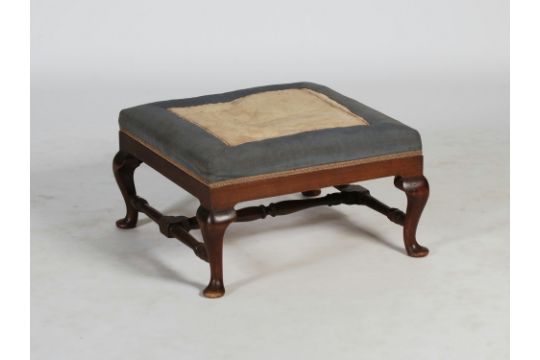 A 19th century mahogany stool, the square upholstered top above a plain frieze, raised on four short