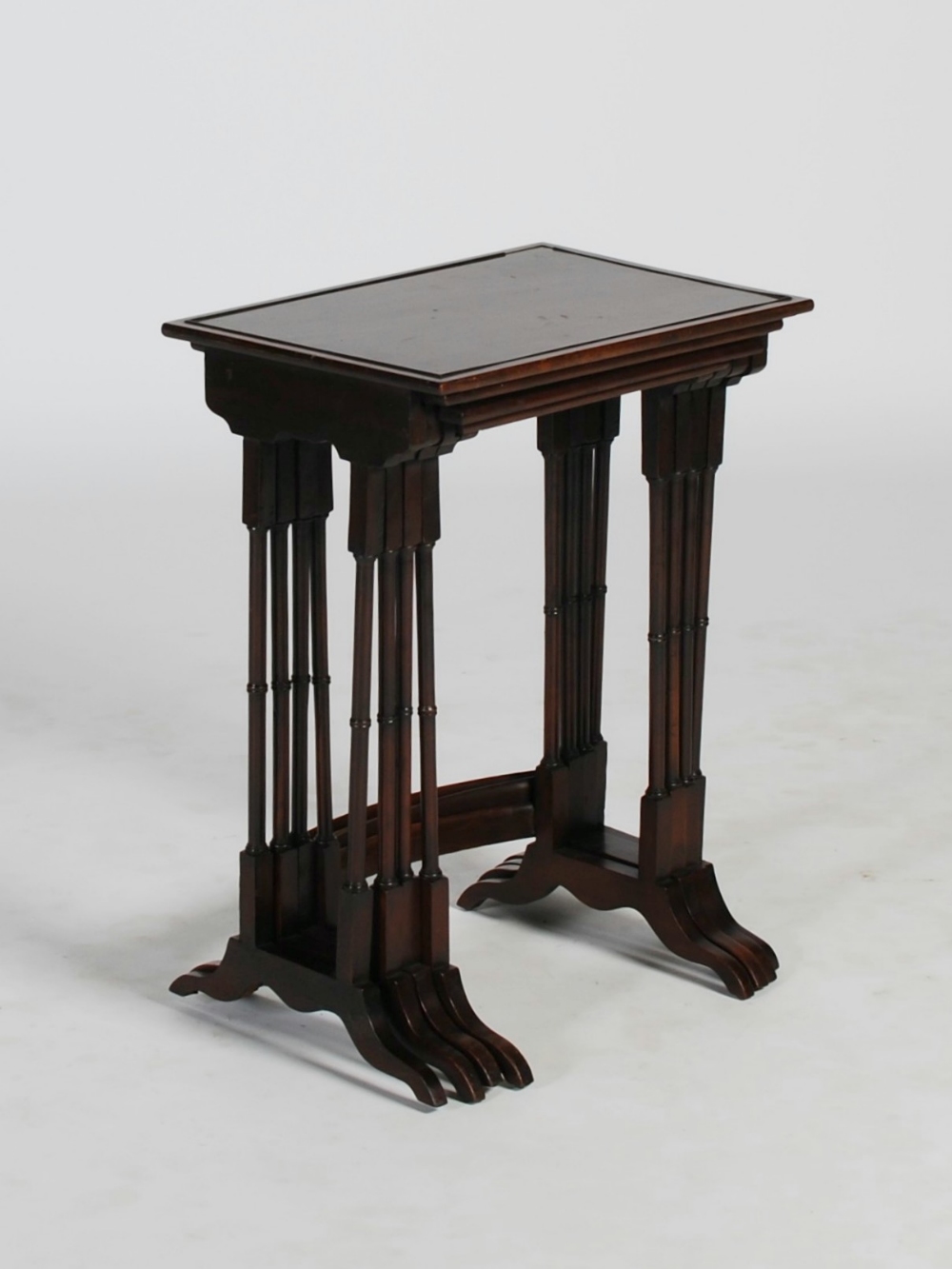 An early 20th century quartetto of mahogany occasional tables, the rectangular tops raised on four