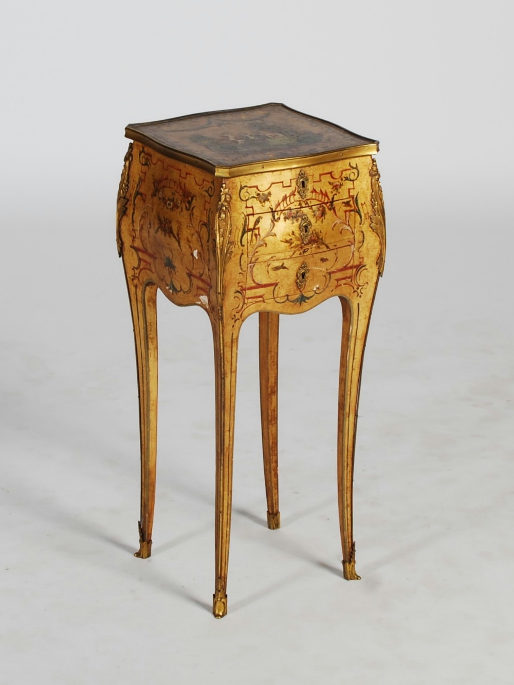 A late 19th/ early 20th century Vernis Martin style work table, the shaped square top decorated with