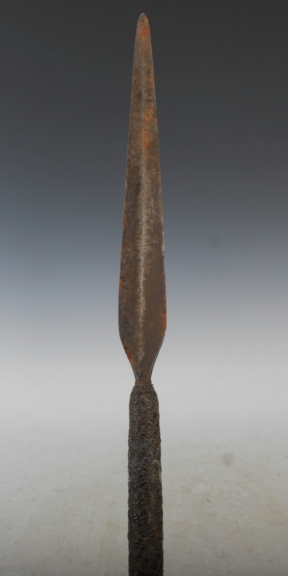 A late 19th century African Tribal stabbing spear, with long double edged blade, with intricately