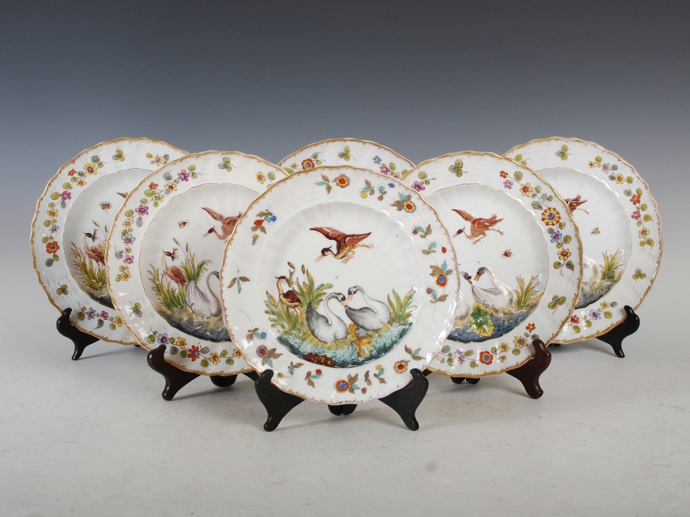A set of six Naples porcelain dessert plates, with moulded decoration of swans and herons within a