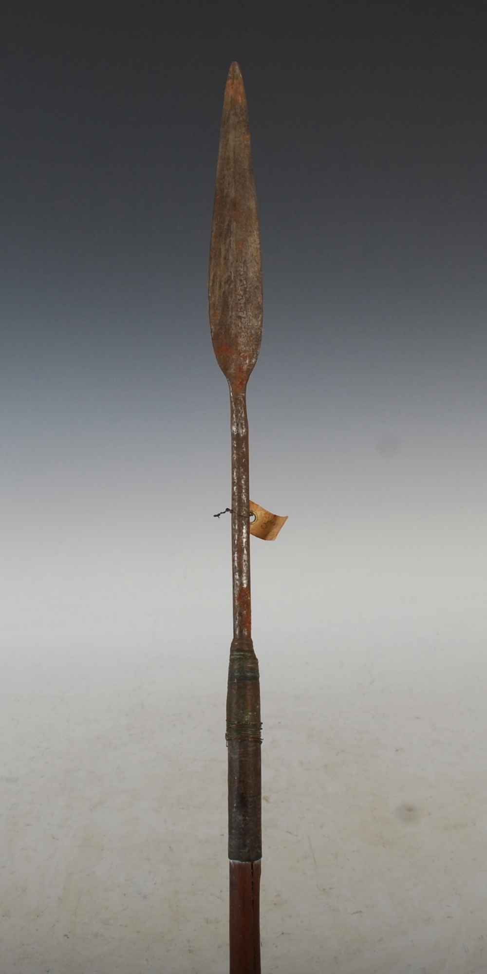 A late 19th century African Tribal spear, with double edged blade, copper wire binding and tapered