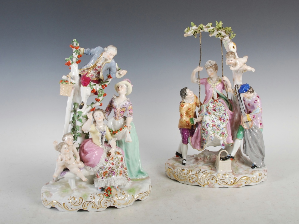 A pair of Meissen style porcelain figure groups, one modelled with lady on a swing with attendants