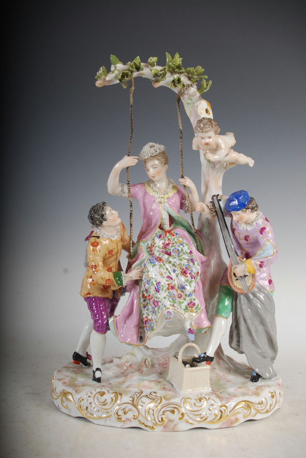 A pair of Meissen style porcelain figure groups, one modelled with lady on a swing with attendants - Image 10 of 12