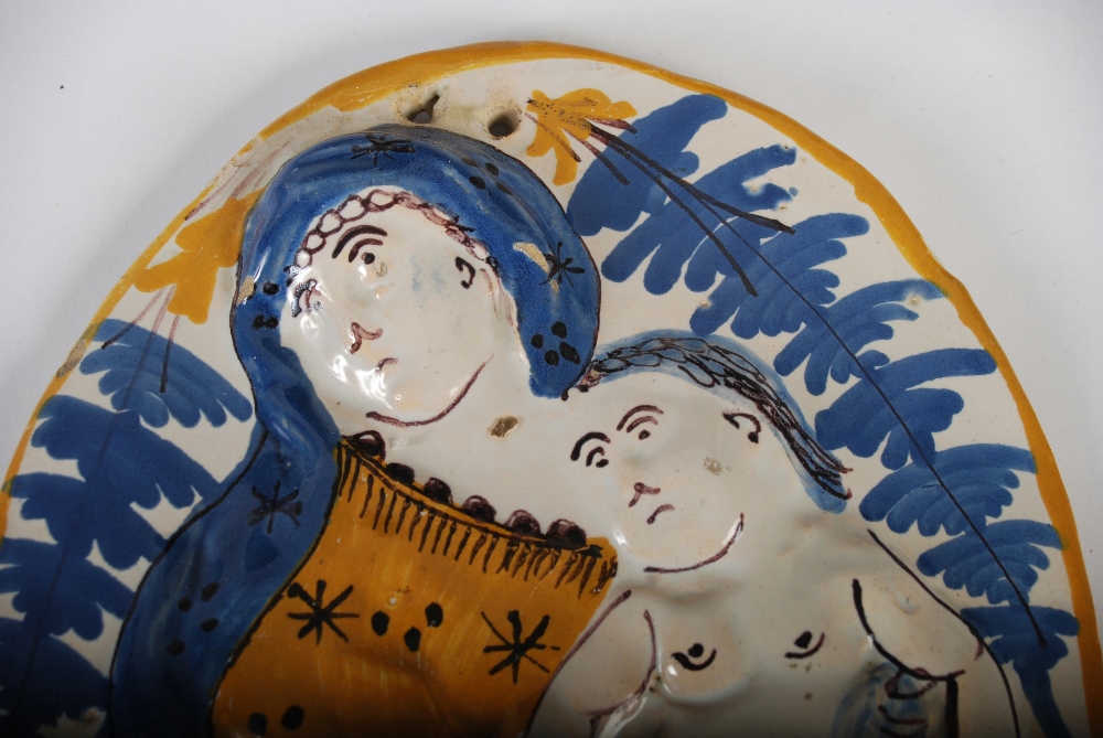 A 19th century Continental pottery oval shaped panel, decorated in relief with a mother and child - Image 3 of 5
