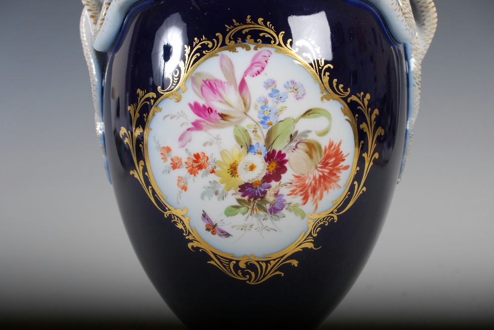 A Meissen cobalt blue ground twin handled urn, decorated with painted panels of colourful flowers, - Image 7 of 7