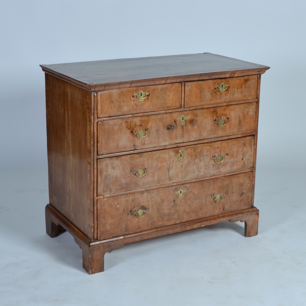 A William & Mary period walnut chest, the rectangular top with quarter cut veneers and chevron