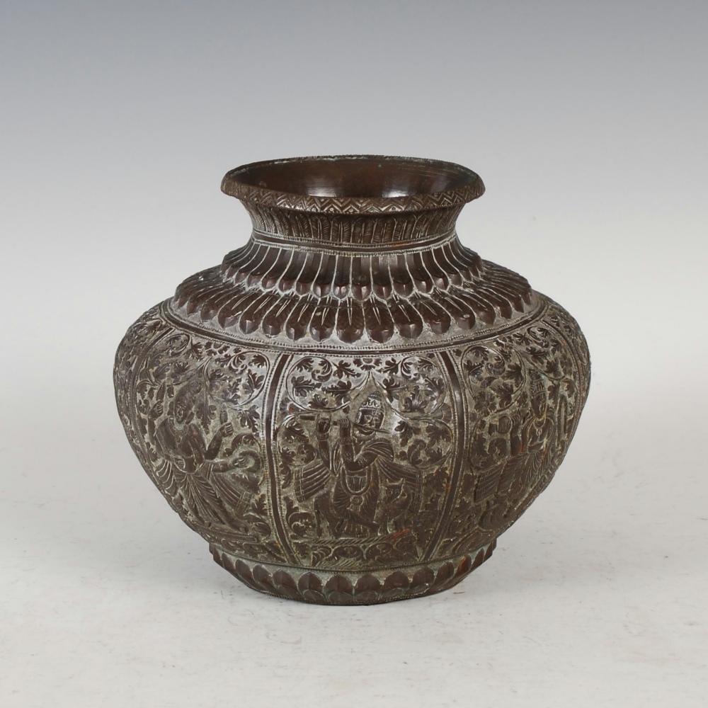 A late 19th century Indian copper jar, decorated with embossed panels of figures on scrolling