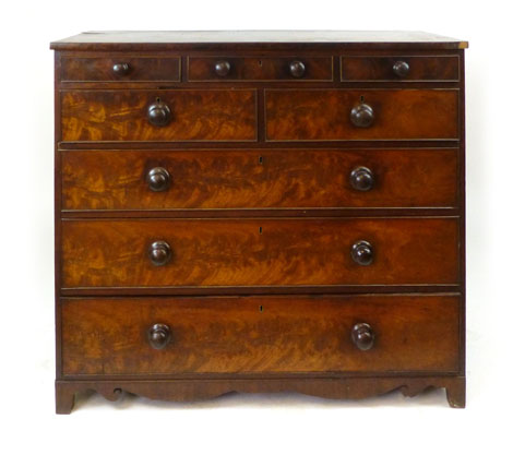 A George III mahogany chest of drawers with three frieze drawers above two short and three graduated