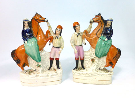 A pair of Staffordshire equestrian figural groups each modelled as a Royal princess seated on a