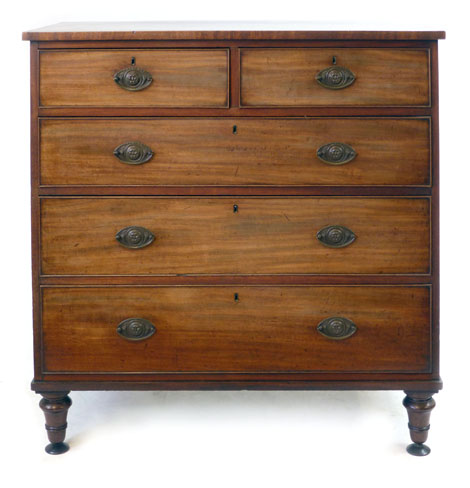 An early 19th century mahogany chest of two short and three graduated long cock-beaded drawers, with