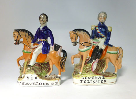A Staffordshire equestrian figure titled 'Sir H. Havelock, CB', h. 23 cm (Pugh 177, p 1268) and