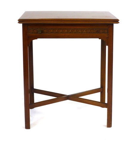 An Edwardian mahogany fold-out card table, the twisting baize lined top above a single drawer with