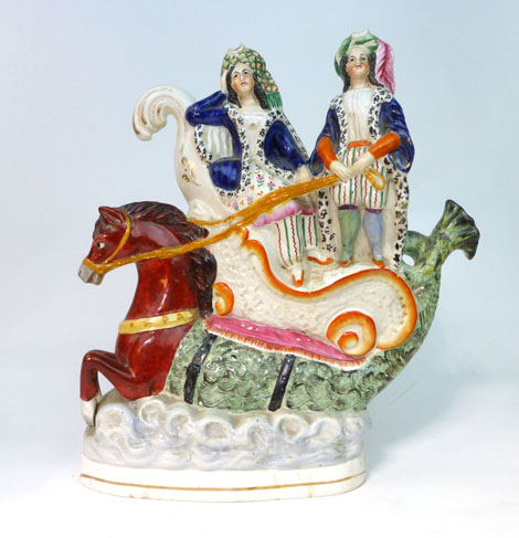 A Staffordshire Threatre or Circus group modelled as a pair of figures in a nautical throne